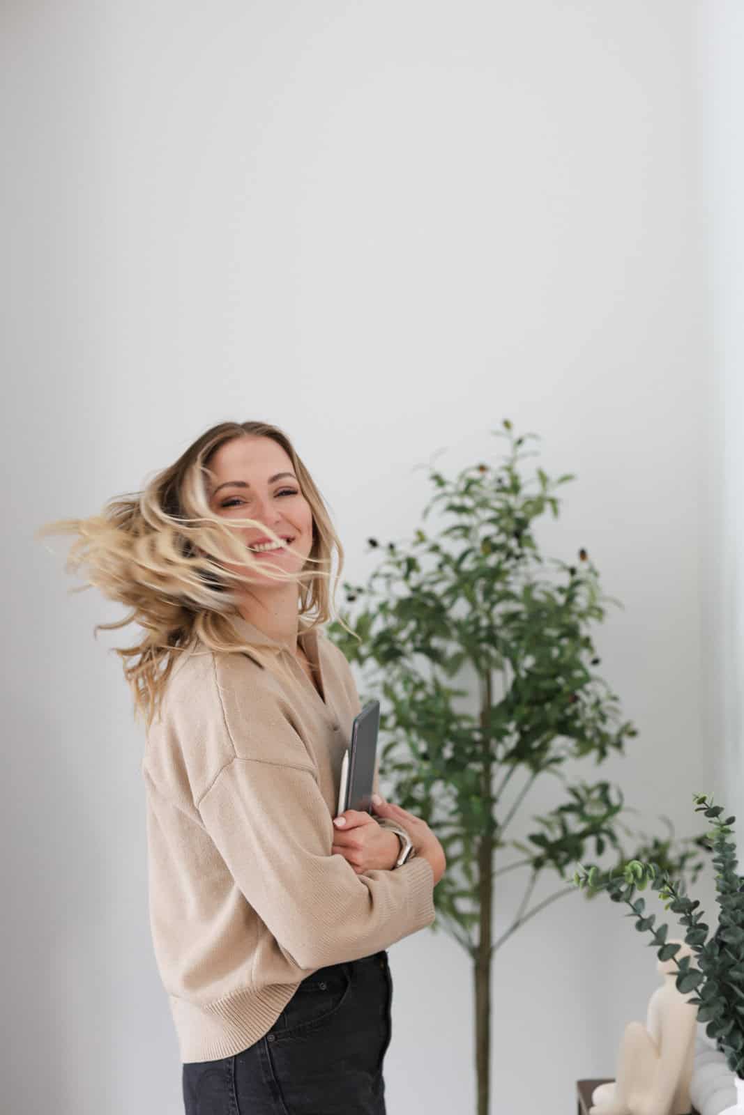 Dr. Heather Iverson smiling in a natural light wellness environment focused on long-term health