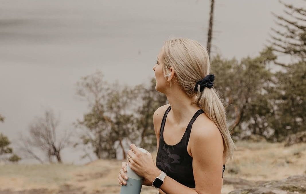 Dr. Heather Iverson staying active and hydrated outdoors, illustrating daily habits that support healthy aging and long-term wellness.